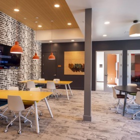 Find your perfect fit at Sterling Fifth Street a room with tables and chairs