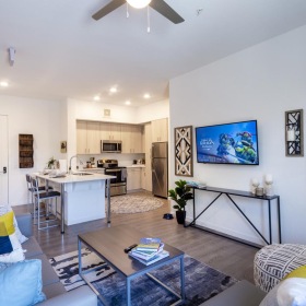 Wide open living areas perfect for entertaining a living room with a tv and couches