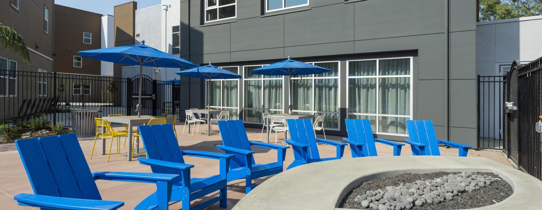 a group of blue chairs outside